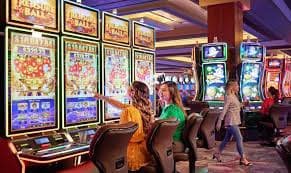 Live dealer table with cards and chips visible on screen